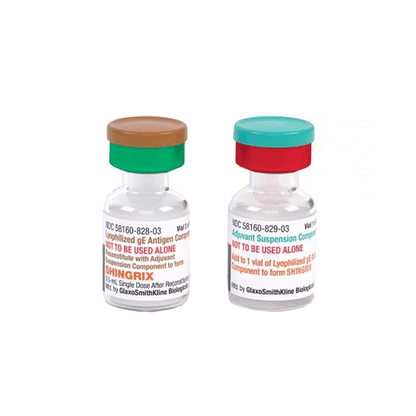 Close-up view of the two Shingrix vials by GSK featuring the lyophilized gE antigen component (brown cap) and adjuvant suspension (teal cap) before reconstitution.